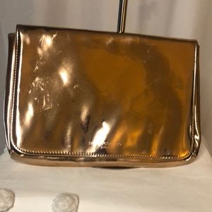 PACO RABANNE metallic rose gold clutch.